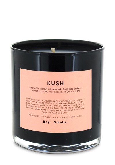 a candle with the word kush on it